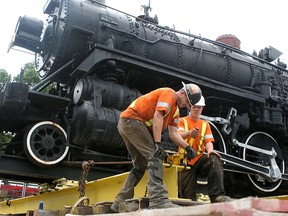 A new website showcases the city's civic collection, which includes the Spirit of Sir John A. locomotive, pictured here being placed in Confederation Park in 2011 after being restored. (Michael Lea/The Whig-Standard)