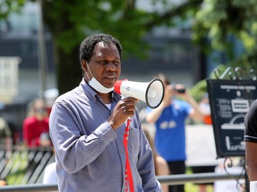 Muhammad Sani, rom the Kingston Immigration Partnership, spoke to crowds during the Justice for George Floyd & All Police Racism Victims protest at Confederation Park in downtown Kingston on Saturday, June 6, 2020. Meghan Balogh/The Whig-Standard/Postmedia Network
