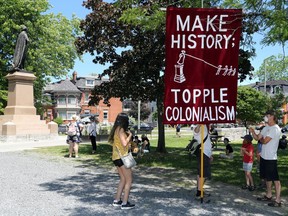 Protesters assembled in City Park in Kingston on June 20 to demand that the City of Kingston take down a statue of Sir John A. Macdonald that stands in the park. (Meghan Balogh/The Whig-Standard)