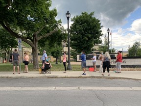 Hundreds of people line up to be tested for COVID-19 at the Memorial Centre after an outbreak of the virus in Kingston. (Elliot Ferguson/The Whig-Standard)