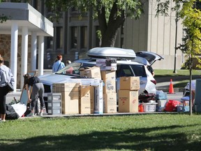 Thousands of first-year Queen's University students unloaded their belongings and said goodbye to parents during move-in day at 17 residence buildings across campus on Aug. 30, 2019. The scene could be a little less hectic this year as the university has announced it will be opening select, single-occupancy residence rooms this September due to the COVID-19 pandemic. (Meghan Balogh/The Whig-Standard)