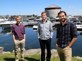 Wavve App founder and CEO Adam Allure, right, with marketing manager Dylan Ratcliffe, left, and software developer Jake Murphy at Kingston's Confederation Basin on Monday. (Ian MacAlpine/The Whig-Standard)