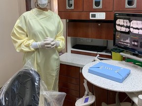 Dr. Carolyn Deck, of Deck Dentistry in Mitchell, is ready to begin her work day - with a gown, gloves, N95 mask, face shield and head cap. It's the new normal patients can expect moving forward. SUBMITTED