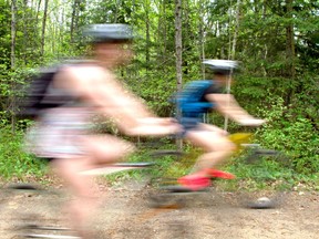 Cyclists take advantage of a nice day to ride the Cranberry Trail in Callander. 
Mackenzie Casalino