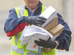 Canada Post set a one-day delivery record May 19 with 2.1 million parcels.
Postmedia Photo