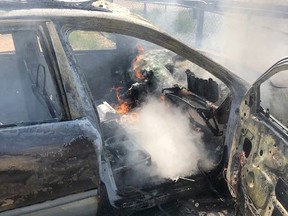 The remnants of the vehicle interior after fire crews beat down the flames. Photo supplied.