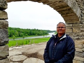 File photo of Saugeen First Nation member Jennifer Kewageshig who stands at the archway which leads to the amphitheatre which is being rebuilt as part of a rejuvenation of the site. (Scott Dunn/The Sun Times/Postmedia Network)
