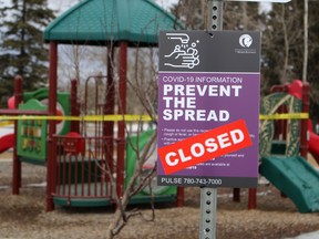 A closed sign stands in front of a playground in Beacon Hill in Fort McMurray, Alta., on Sunday, April 19, 2020. Laura Beamish/Fort McMurray Today/Postmedia Network ORG XMIT: POS2004202158516295