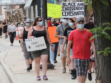 Participants chant as they walk through Pembroke's downtown core during a Black Lives Matter rally called Pembroke's March Against Injustice on Tuesday, June 9. Anthony Dixon