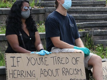 United in solidarity against racism and the coronavirus, these march participants make their feelings known through a message on a sign at Pembroke's March Against Injustice. Anthony Dixon