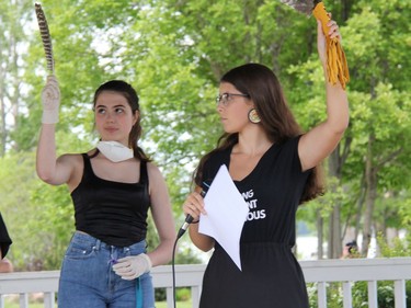 Before setting out for the march portion of the anti-racism rally, Belle Bailey, right, presented each of the organizers with a gift of a feather and tobacco that they all lifted towards the sky to demonstrate solidarity with each other against racism and to give thanks that they can be part of systemic change. On the left is Emily Lehman. Anthony Dixon