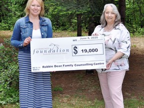 Monique Yashinskie, executive director of the Robbie Dean Family Counselling Centre, accepts a cheque for $19,000 from Debbie Ryan (right), executive administrator/community liaison for the Pembroke Petawawa District Community Foundation.