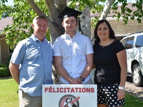 Proud parents Dean and Tanya pose for a photo with their son, Marek Felhaber who is the Class of 2020 valedictorian at École Secondaire Publique L'Équinoxe. Submitted photo