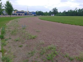 Work will begin on replacing the surface of the track at Bishop Smith Catholic High School. The track will first be paved and then a synthetic rubberized layer will be added on top. Anthony Dixon