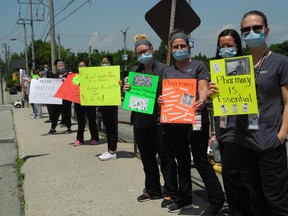 Healthcare workers at the Brantford General Hospital rally over their lunch period Friday, saying they have been cut out of the province's pandemic pay plan.