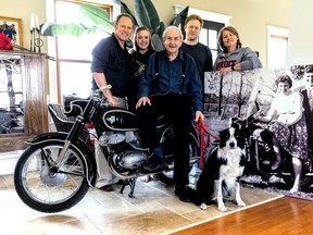 The framed picture shows Wilhelmina and Bill 60 years ago before leaving for Canada, and the motorcycle found and brought to Canada this spring by their family