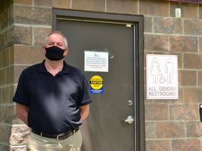 Stratford community facilities manager Jim Bryson poses next to the North Shore washroom, one of four washrooms around Stratford's Lake Victoria that will be reopened to the public this Saturday. (Galen Simmons/The Beacon Herald)