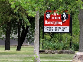A hair salon reminds customers it can't open until the province eases COVID-19 restrictions on Tuesday June 9, 2020 in Petrolia, Ont. (Terry Bridge/Sarnia Observer)