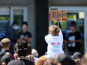 A person holds up a Black Lives Matter sign during a rally on Saturday June 13, 2020 in Sarnia, Ont. Terry Bridge/Sarnia Observer/Postmedia Network