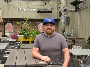Kevin Larson, owner of The HUB Pub and Patio sits the restaurant's COVID-friendly rooftop patio after reopening the outdoor space in mid-June. (Galen Simmons/The Beacon Herald)