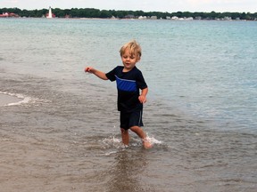 Paul Morden/The Observer
Joshua Thomas, 3, plays in the water during a visit to Canatara Park Beach in Sarnia with his family. Lambton public health began testing water quality this week at several public beaches in Sarnia and the rest of Lambton County.