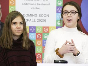 Members of the youth committee for Sarnia's Access Open Minds centre Maura Cook, left, and Janessa Labadie, both 16, address dignitaries gathered at 190 Front St. in Sarnia in December 2019. The Lambton County-owned former downtown bank branch has been selected as the site for the mental health and addictions-focused facility for 11-25-year-olds. Tyler Kula/Sarnia Observer/Postmedia Network