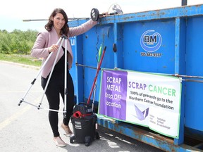 Elizabeth Taillefer, of the Northern Cancer Foundation, drops off a number of items at the Scrap Cancer bin location at Ramakko's on Regent Street in Sudbury, Ont. on Monday June 1, 2020. "Scrap Cancer is a very 'Sudbury' way to donate to cancer care and awareness right here in Northeastern Ontario," said a release from the foundation. "Every dollar raised by scrap metal and electronic waste during the months of June and July will be donated to the Northern Cancer Foundation to change cancer experiences and outcomes in the North." Individuals and organizations can participate. Organizations can take part by asking employees to bring in scrap metal and/or gather unused material, and BM Metals will collect the items, while people can drop off scrap metal and electronic waste at bins located at Bianco's Supercenter, RamakkoÕs or the Northeast Cancer Centre. John Lappa/Sudbury Star/Postmedia Network