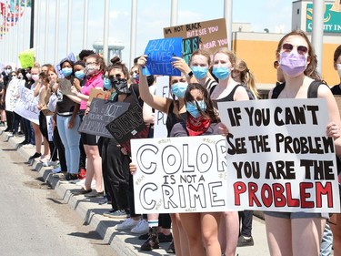 Hundreds of people lined both sides of the Bridge of Nations during a protest against racism and police brutality in Sudbury, Ont. on Wednesday June 3, 2020. John Lappa/Sudbury Star/Postmedia Network