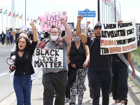 TiCarra Paquet, left, cousin of Regis Korchinski-Paquet, who fell to her death in Toronto, participates in a protest against racism and police brutality on June 3. Another Black Lives Matter rally is now planned for Friday, starting in Bell Park at 1 p.m.