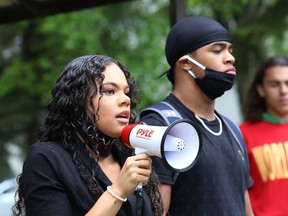TiCarra Paquet, left, cousin of Regis Korchinski-Paquet who fell to her death last week in Toronto, addresses a crowd at a protest against racism and police brutality in Sudbury, Ont. on Wednesday June 3, 2020.