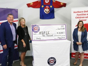 Mark and Karen Burgess, owners of the Rayside Balfour Canadians, presented a $10,000 cheque to Dayna Caruso, right, director of Northern Ontario Families of Children with Cancer, at a presentation in Sudbury, Ont. on Thursday June 4, 2020.