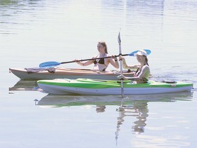 Lexie Smith, front, and Calla Legue kayak on Ramsey Lake in Sudbury, Ont. on Thursday June 4, 2020.