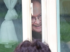 Lucy McGaughey visits with her dad, Mario DiPietro, at Pioneer Manor in Sudbury, Ont. on Monday June 8, 2020.