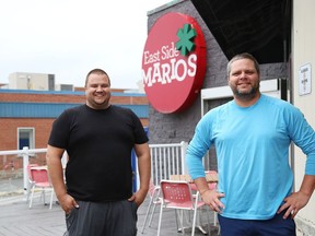 Kitchen manager Roch Dufresne, left, and franchise owner Jeff Cook stand on the patio of East Side Mario's on Lasalle Boulevard in Sudbury, Ont.  on Wednesday June 10, 2020. The patio area will be open for customers starting on June 12.