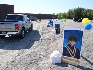 More than 50 graduating students and their families participated in St. Anne Catholic School's Grade 8 drive-thru graduation ceremony in Hanmer, Ont. on Wednesday June 17, 2020. John Lappa/Sudbury Star/Postmedia Network