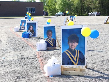 More than 50 graduating students and their families participated in St. Anne Catholic School's Grade 8 drive-thru graduation ceremony in Hanmer, Ont. on Wednesday June 17, 2020. John Lappa/Sudbury Star/Postmedia Network