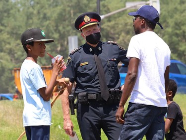 Greater Sudbury Police Chief Paul Pedersen, middle, attended the Black Lives Matter: Juneteenth Racial Injustice Rally at Bell Park in Sudbury, Ont. on Friday June 19, 2020. John Lappa/Sudbury Star/Postmedia Network