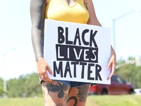 A participant takes part in the Black Lives Matter: Juneteenth Racial Injustice Rally at Bell Park in Sudbury, Ont. on Friday June 19, 2020.