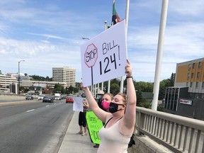 More than 50 local nurses and supporters protested against Bill 124 Friday on the Bridge of Nations.