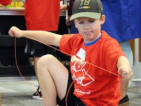 In this file photo, Camden McLeod, a camper at Science North's TechWhiz program for ages 7-9, experiments with supplies at the chain reaction station at the new THINK Hub launched in Sault Ste. Marie. File photo