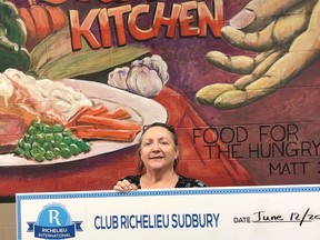 Christine Newberry, kitchen manager of the Elgin Street Mission, receives a $1,000 cheque from Club Richelieu Sudbury to help supply lunches to the homeless. Supplied photo
