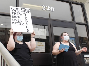 Sara Nightingale is seen here on the left on the steps of city hall with her cousin Sarah McKeachnie who organized the anti-racism rally in Timmins on Friday. 

RICHA BHOSALE/The Daily Press