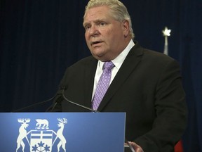Premier Doug Ford has given green light for more businesses to open this Friday across most of the province, excluding the Toronto, Hamilton and Niagara areas. (JACK BOLAND/Postmedia Network)