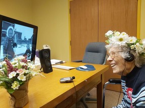 Marguerite Boutin, a resident of the Golden Manor, watches a video photo album of her life as she celebrated her 100th birthday on Tuesday. With the use of Zoom technology, she and family members were able to watch the video together.

Supplied/Sue Walton