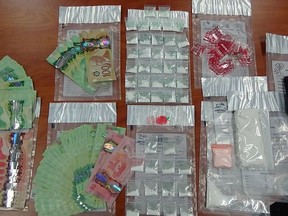 The Ontario Provincial Police provided this photo of the suspected cocaine, drug paraphernalia and Canadian currency seized from a residence in Kapuskasing earlier this month. Police say the street value of all seized items was approximately $20,000.

Supplied