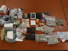 The Ontario Provincial Police in Cochrane provided this photo of the suspected cocaine, fentanyl, cannabis, drug paraphernalia and Canadian currency seized from a residence in Cochrane earlier this week. Police say the street value of all seized items was $100,000.

Supplied