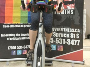 Kate Durst, co-owner and coach at Discover Fitness/Discover Performance Inc., pedals in support of the Timmins Virtual Pride Ride being held this Thursday.

Supplied