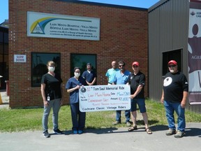 Members of the Cochrane Classic Vintage Riders Dan Girard, Norm Bouvier and Guy Bougie proudly presented a cheque to Lynne LaRose (Patient Care Co-ordinator), Courtney Bradley (Registered Nurse), Paul Chatelaine (MICs CEO) and Dr. Joey Tremblay (Chemo Physician Lead) behalf of the MICS Group Health Services. The money will go towards the  Chemotherapy Room at the Lady Minto Hospital. Submitted photo.jpg