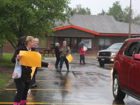 Members and volunteers from the EarlyON and the Cochrane Child  Care Centre programs got drenched while entertaining children last week. TP.JPG