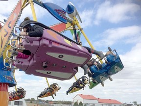 Visitors to the 2019 edition of the Brigden Fall Fair enjoy the midway. The Moore Agricultural Society has postponed this year's edition of the Brigden Fair until 2021 because of the pandemic. The popular fair, one of the largest in Southwestern Ontario, is always held on Thanksgiving Weekend in October. Peter Epp/Postmedia Network